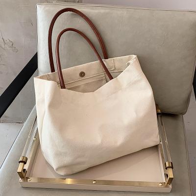 China Latest design high quality canvas women's handbags ladies large fashion casual patchwork simple color pinch for sale