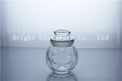 China Custom machine pressed small pumpkin face glass jar for sale