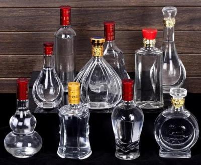 China Cheap high white galss vodka bottle whisky glass bottle 700ml 750ml glass liquor bottle for sale