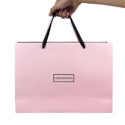 China Recycled Materials Cheap Price Custom Printing Logo Rose Pink Paper Gift Packaging Bag Recycle Shopping Tote With Silk Ribbon for sale