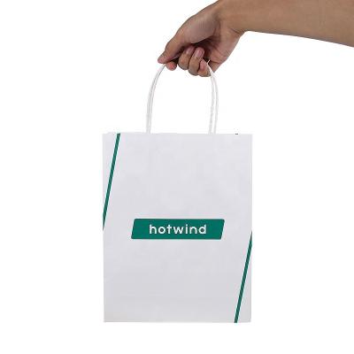 China Custom Recycled Logo Printed Retail Store Packaging Materials Factory Price Gift Tote Craft Paper Bag For Clothing Promotional for sale