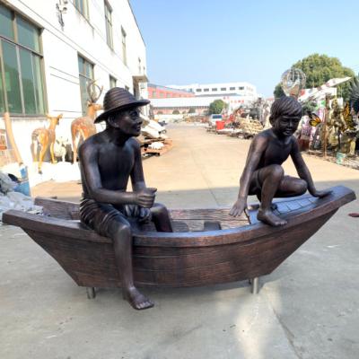 China Custom Life Size Bronze Statues Of Durable Modern Famous Abstract Father And Son Sitting On Boat For Outdoor Decoration for sale