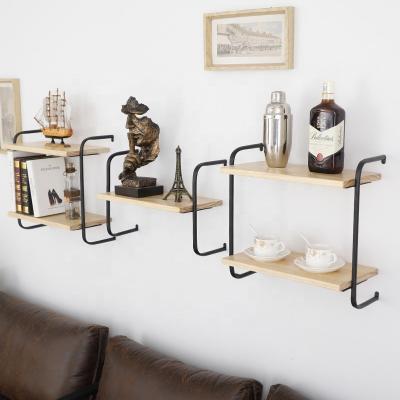 China Convertible Solid Wood Decorative Wall Shelf Wrought Iron Word Divider Wall Hanging Living Room Bedroom Layer Wall Shelf for sale