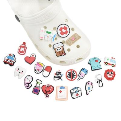 China Flexible Croc Kids Charm Shoe Buckle Accessories Eva Sandal Shoe Top Ornaments PVC Glue Buckle Clog Charm Cartoon Medical Shoe Ornament for sale