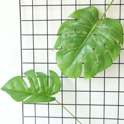 China Jungle Theme Plastic Silk Party Supplies Plant Fake Green Turtle Plam Leaf Decorative Artificial Monstera Deliciosa Leaves for sale