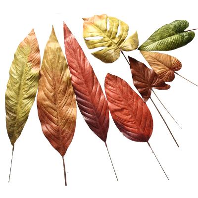 China Artificial Faux Monstera Plastic Silk Plant Leaves Ornamental Plants Red Leaf For Tropical Leaves Birthday Beach Jungle Party Room Decoration for sale