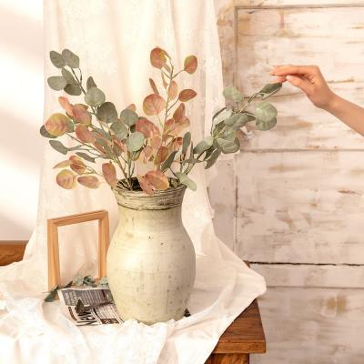 China DIY Craft Plastic Flower Branch Green Leaves Decoration Eucalyptus Artificial Plant Simulated Flower Arrangements For Home for sale