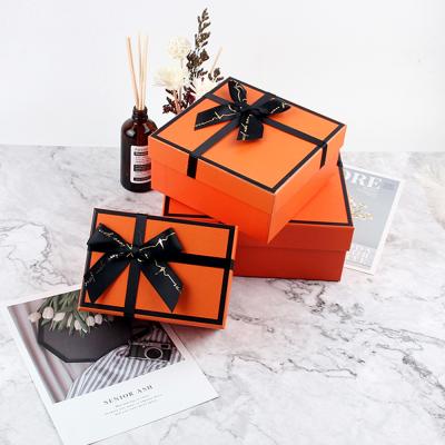 China Recycled Materials Like Premium Cardboard Boxes Printing Expansion Packaging Box Orange Custom Logo Paper Boxes for sale