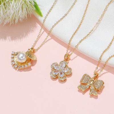 China Customization Ornaments Women's Latest Design 18k Korean Copper Gold Women's Latest Design Zircon Chain Clavicle Necklace Charm Pearl Bow Flower Fashion Pendant Necklace for sale