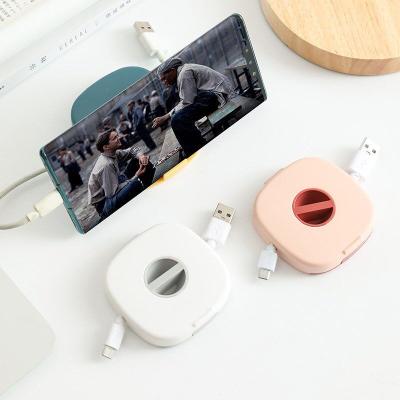 China For New Earphone Square Earphone Cable Organizer With Mobile Phone Multifunctional Rotatable Holder for sale