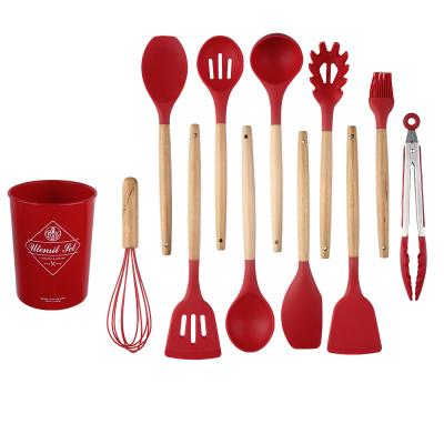 China Amazon Viable Success Handle Kitchen Tool Kits Silicone 12pcs Multifunctional Wood Kitchenware Sets Food Grade Silicone Cookwares for sale