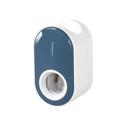 China 2021 New Fashion Household Toothpaste Squeezer Bathroom Wall Mounted Toothpaste Holder Viable Automatic Creative Toothpaste Dispenser for sale