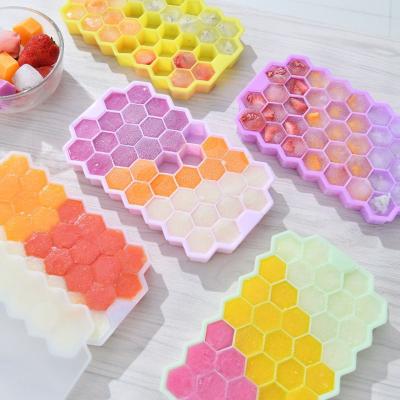 China New Viable Creative Amazon Silicone 37 Holes Ice Tray Hexagon Fruit Ice Tube Tray With Lid Food Grade Silicone Honeycomb Ice Tray for sale