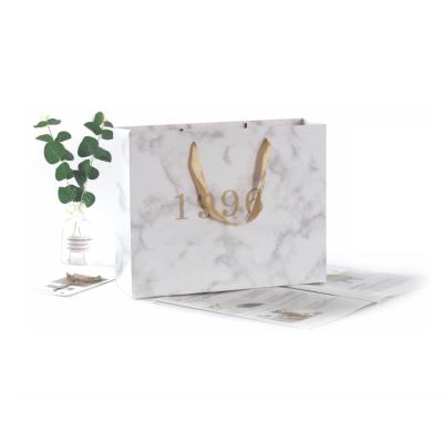 China Recyclable Luxury Special Design Recycling Gift Wrapping Kraft China White Marbling Paper Small Bag With Logo for sale