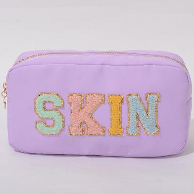 China Stock Fashion Small MOQ Factory New Nylon Cosmetic Bag Can Customized Make Up Bag With Chenille Letter Patches for sale