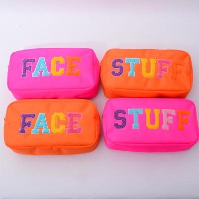 China Low MOQ Large Capacity Travel Towel Waterproof Running Nylon Embroidery Patches Logo Small Cosmetic Bags for sale