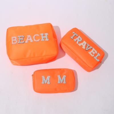 China Lady Monogram Chenille Patches Low MOQ Woman Cosmetic Bag Small Wash Bag Waterproof Running Nylon Custom Makeup Pouch for sale