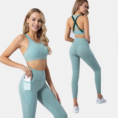 China Dropshipping Custom Breathable Two Piece Sportswear Zipper Leggings And Bras Moq Yoga Bottom Sets Women With Pockets for sale