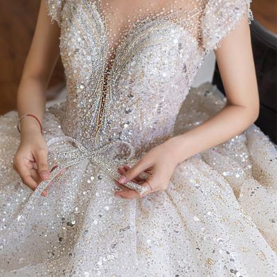 China Applique Crystal Anti-static Thin Romantic Tow Big V-Neckline Lace Up Fabric For Wedding Dresses for sale