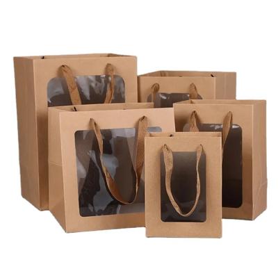 China Recyclable Wholesale Creative Waterproof Transparent Bouquet Paper Bag Packaging Bag Window Opening for sale