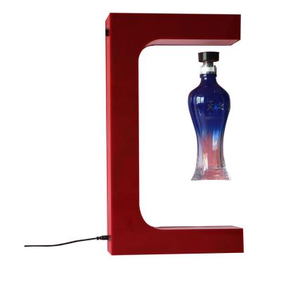 China Shenzhen Rotating Floating Magnetic Levitating Customized Bottle Display Rack Wine Beer Liquor Advertising Acrylic Magnetic Floating Shelf For Store Shop for sale