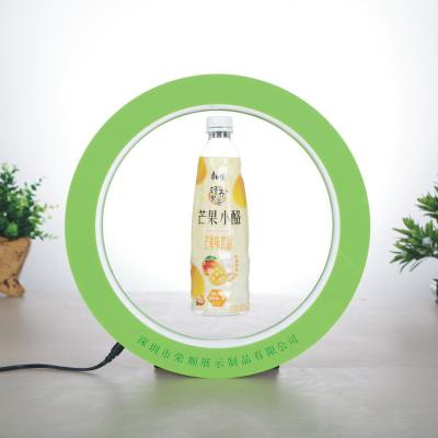 China Floating Rotating Commercial Liquor Magnetic Levitating Fixture Water Drinks Wine Bottle Display Stand Magnetic Floating Beer Can Display Led 360 Degree Rotation for sale