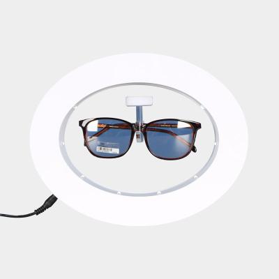 China Morden Advertising Display Oval Shape Rotating Display Stand Magnetic Levitating Glasses Eye Glass Acrylic Floating for sale