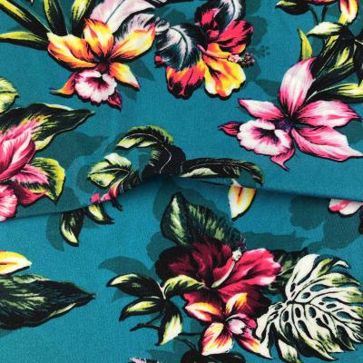 China Shiny stretch jdttex polyamide lycra warp knitted fabric breathable tropical printed swimwear for sale