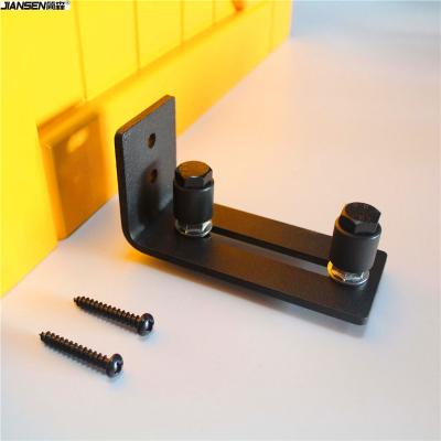 China Modern Powder Coated Black Adjustable Channel Wall Mount Floor Guide Roller For Barn Door Hardware for sale