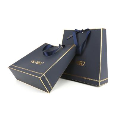 China Blue High End Custom Touch Paper Gold Hot Stamping Logo Gift Paper Bag With Handles for sale