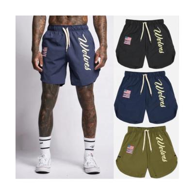 China Jiaer-Fitness Anti-Wrinkle Polyester Gym Workout Beach Pockets Shorts Logo Breathable Drawstring Letter Print Custom Plus Size Mens Shorts for sale