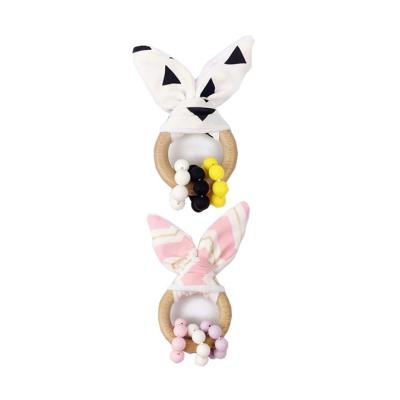 China Safety and Chewable Teether Infant Toy Baby Teething Wooden Ring Gift Set Organic Bunny Ear Wood Rattle Teether for sale