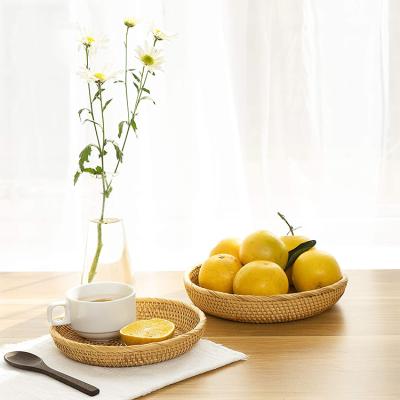 China YRMT Factory Direct Viable Round Rattan Woven Fruit Basket Tea Tray Living Room Storage Basket for sale