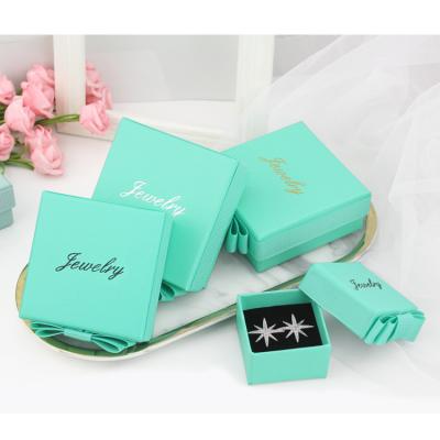 China Custom high quality fancy gift box ribbon packaging jewelry box necklace earings ring logo hot selling colorful jewelry paper wholesale for sale