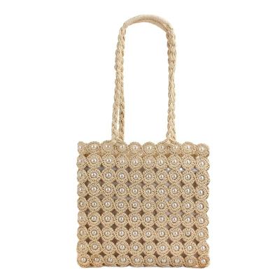 China New High Quality Handmade Shoulder Portable Shopping Bag Holiday Pearl Inlaid Straw Woven Handbag for sale