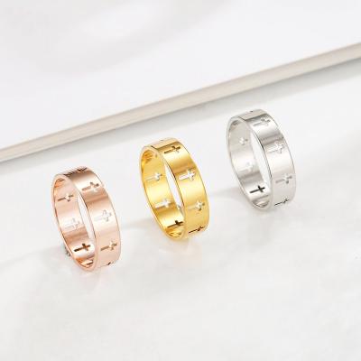 China Simple creative hollow titanium steel plated and silver romantic/soft gold 18k big ring crosses for men and women for sale