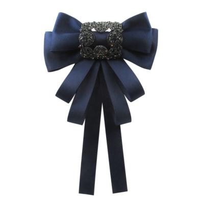 China New Bohemia Rhinestone Bow Pin Bow Ribbon Brooch Silk Fabric Link Bodice Jewelry For Women Shirt Brooch for sale