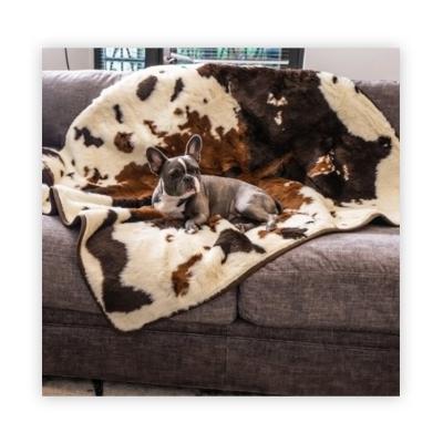 China Washable Cowhide Wholesale Printing Plush Faux Fur Fleece Blanket Luxury Cowhide Blanket For Pet for sale