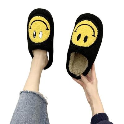 China Fashion Trend Wholesale Winter Fur Couples Fluffy Cotton Home Shoes Women Indoor Bedroom Flats Fleece Plush Smile Face Slides Black Slippers for sale