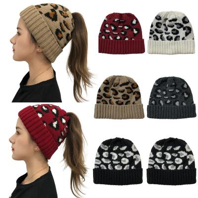 China Newest COMMON Women's Leopard Knitted Beanie Hat Ponytail Braided Winter Cute Wool Beanie Hat Girls Outdoor Warm Beanie for sale