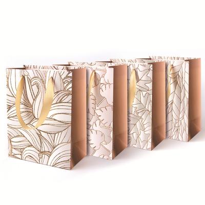 China Gift packahging Customized Luxury Foldable Packaging Ribbon Handle Gift Paper Bag With Logo for sale