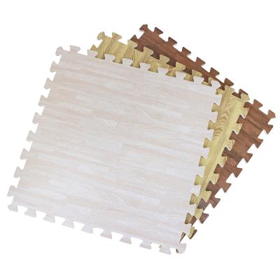 China Waterproof 2020 New Arrival Wood Grain Puzzle Eva Foam Flooring Plastic Mat For Home for sale