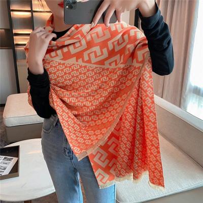 China New winter women's tassel cashmere scarf warm geometric cashmere shawls Korean fashion temperament cape with tide scarves for sale