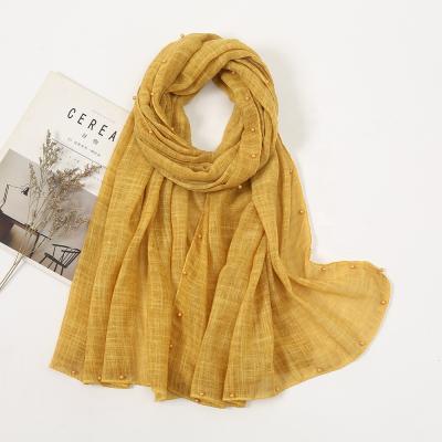 China Daily lifestyle ribbed hijab cotton scarf tudung fold crepe bawal crepe for women gold foil pearl scarf shawl for sale