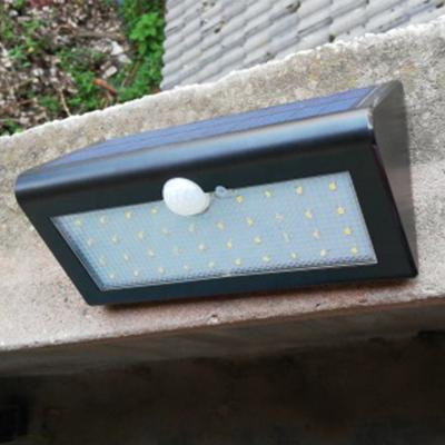 China New Ip65 Battery Solar Powered Garden 2022 Motion Sensor Passageway Lights Outdoor Waterproof External Wall Lights Black White for sale