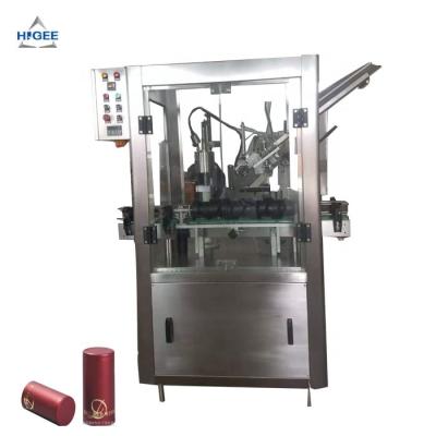 China Food Spirit Plastic Wine Bottle Cap Placing Shrink Machine Automatic Place Tamper Proof PVC Shrink Machine for sale