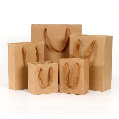 China Disposable Custom Printed Logo Kraft Paper Brown Luxury Paper Gift Carried Shopping Tote Bag for sale