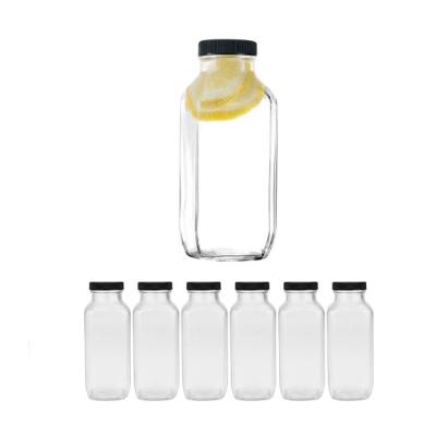 China 12oz 350ml Clear Glass Beverage Drinking Bottles With Caps High Quality Reusable Glass Beverage Bottles Wholesale for sale