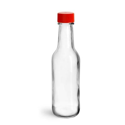 China Food 5 oz 10 oz clear glass dazed bottles with red black ribbed striped caps for hot sauce drink packaging wholesale for sale