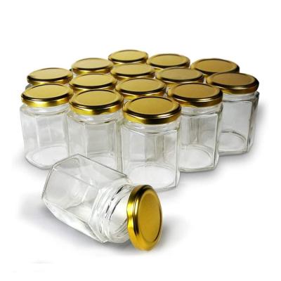 China 6oz 180ml Food Hexagon Jars Gold Lid Hexagon Glass Jars with Gold Plastisol Lined Lids for Homemade Honey Hot Sauce Sauce Packaging for sale